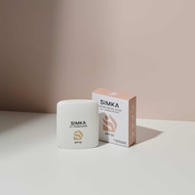 SIMKA sunscreen product and packaging on a neutral background