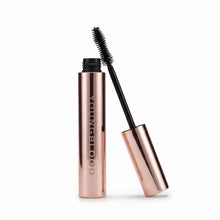 Mascara with rose gold casing and black wand on a white background