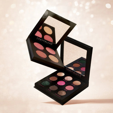 Makeup palette with colorful shades on a soft background