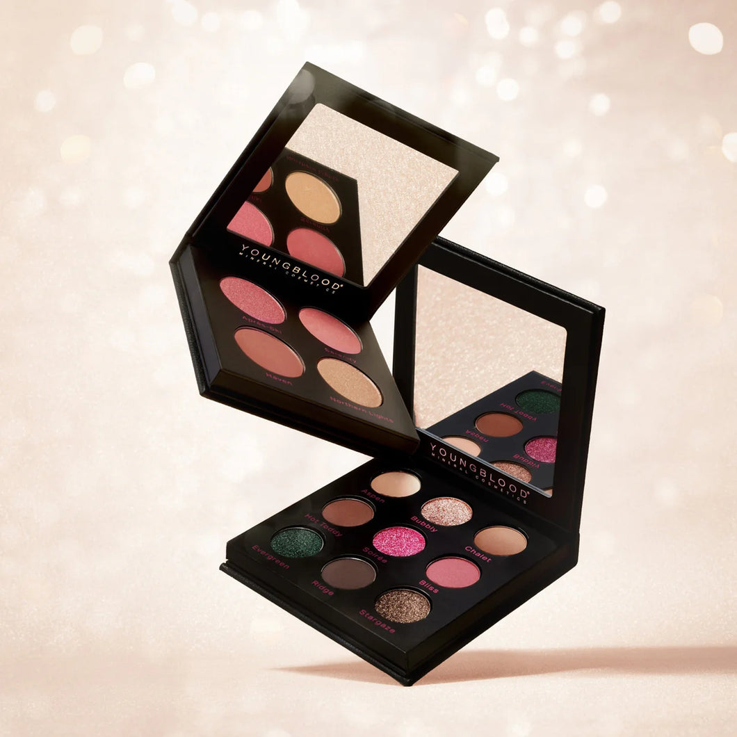 Makeup palette with colorful shades on a soft background